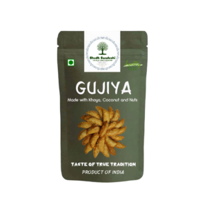Home Shudh Swadeshi Gujiya – traditional Indian sweet with a crispy flour shell and a rich filling of khoya, coconut, nuts, jaggery, semolina, saunf, and cardamom.